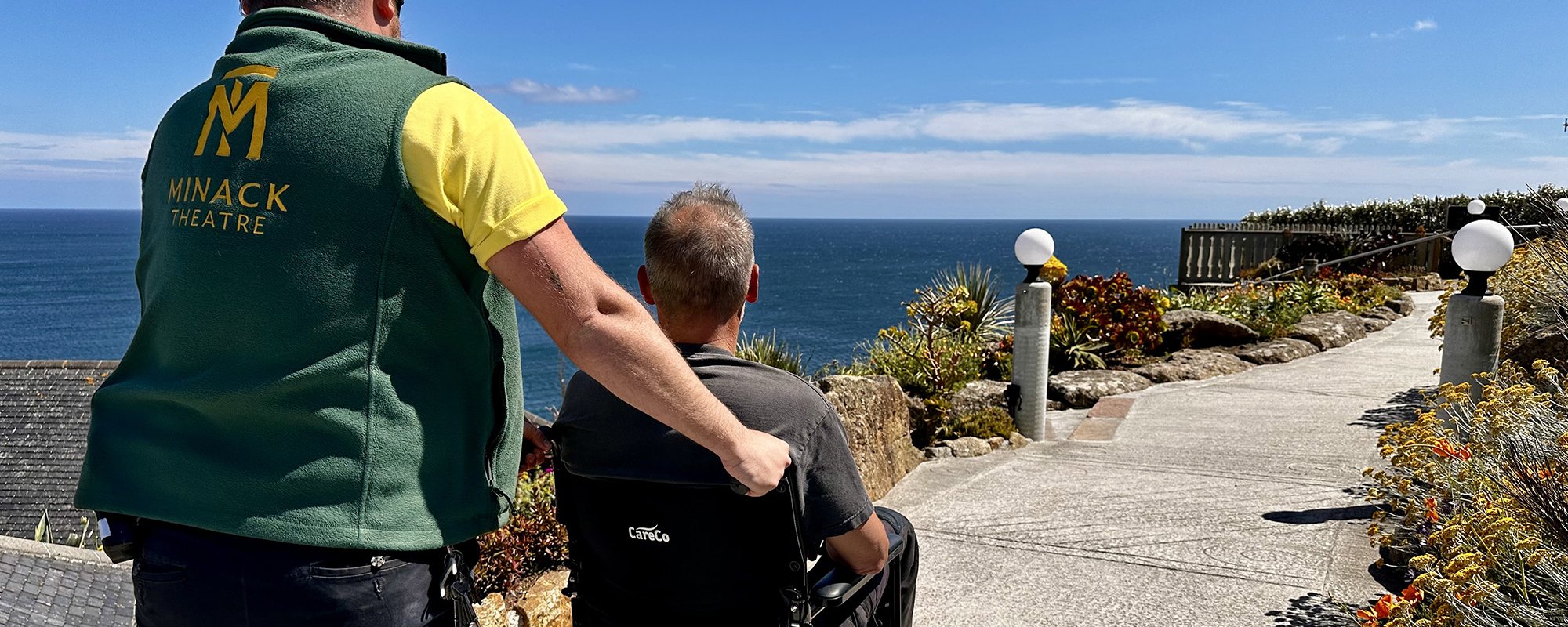 Wheelchair user on accessible route in theatre