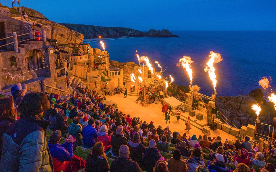 Evening performance on the Minack stage with plumes of live fire