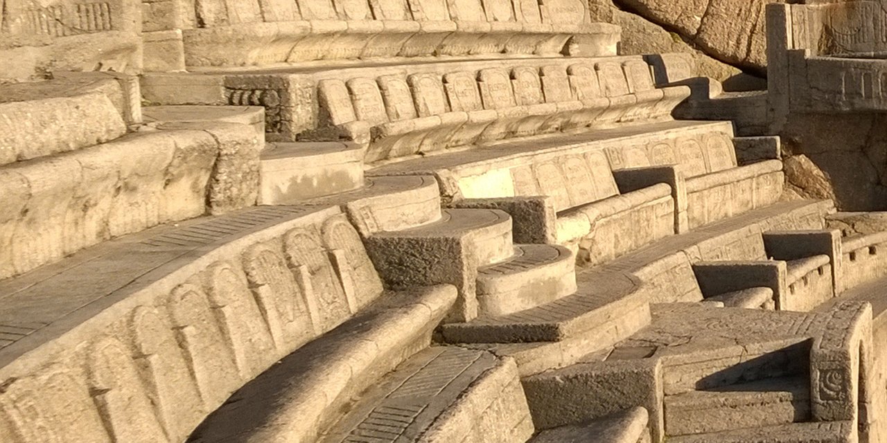 Close up of concrete seating in morning light