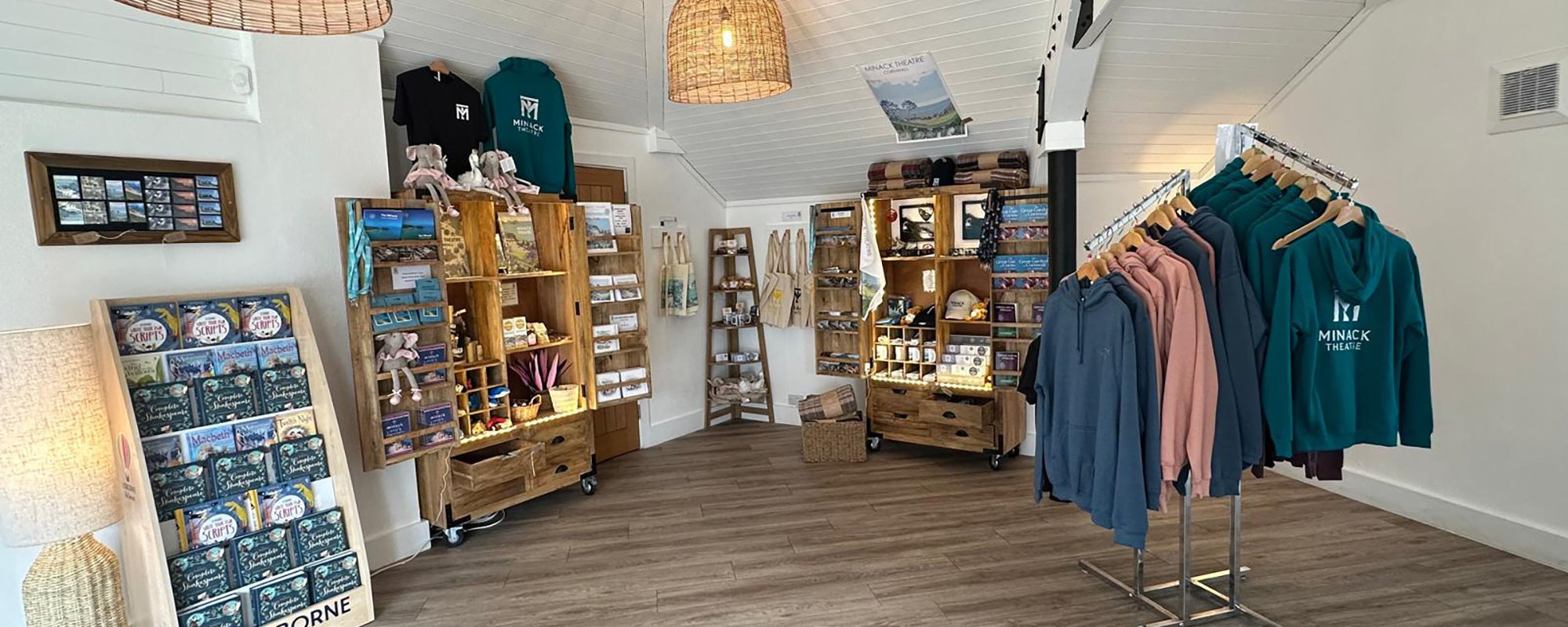 The Minack gift shop showing clothes, books and other items for sale.