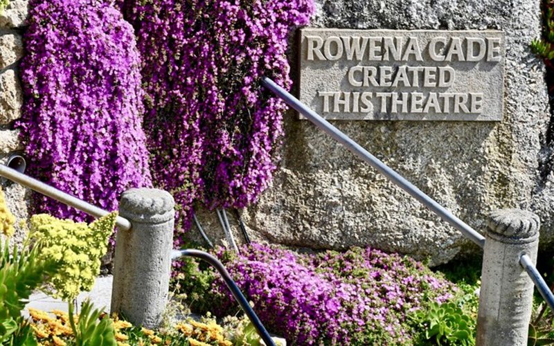 Plaque commemorating Rowena Cade with cascades of Delosperma