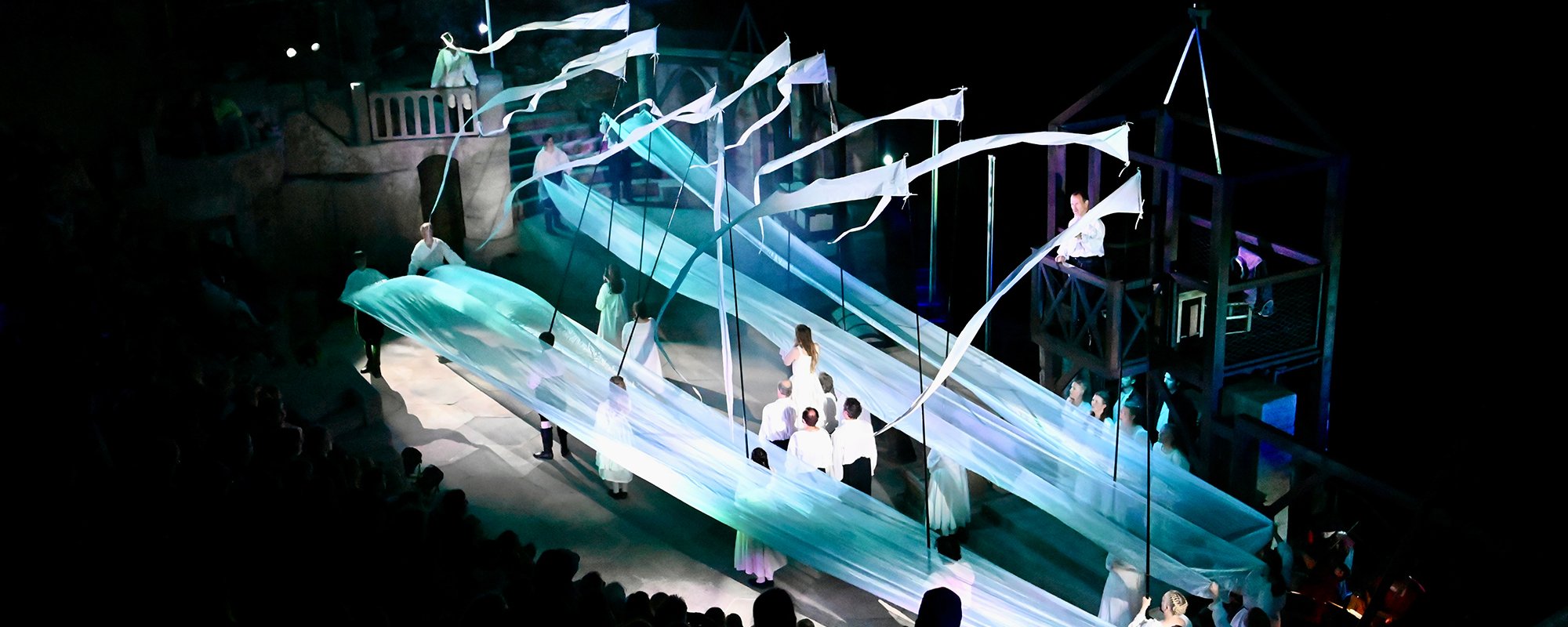 Actors performing on the Minack stage