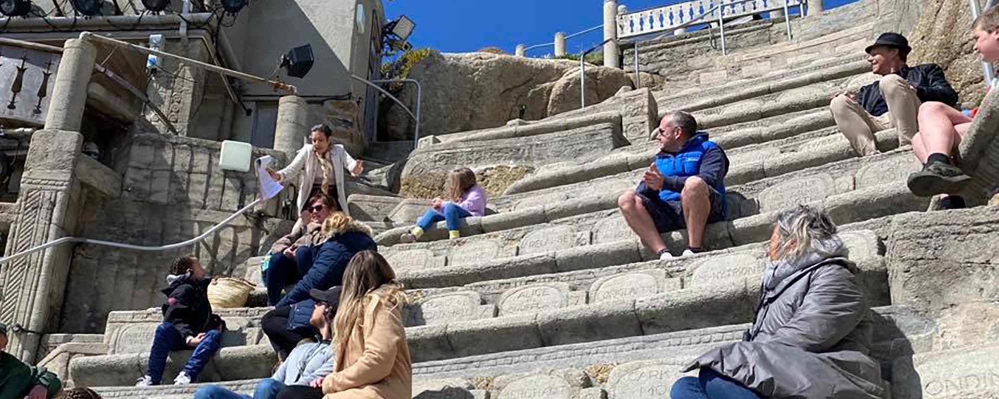 Guide giving a tour to a group of people