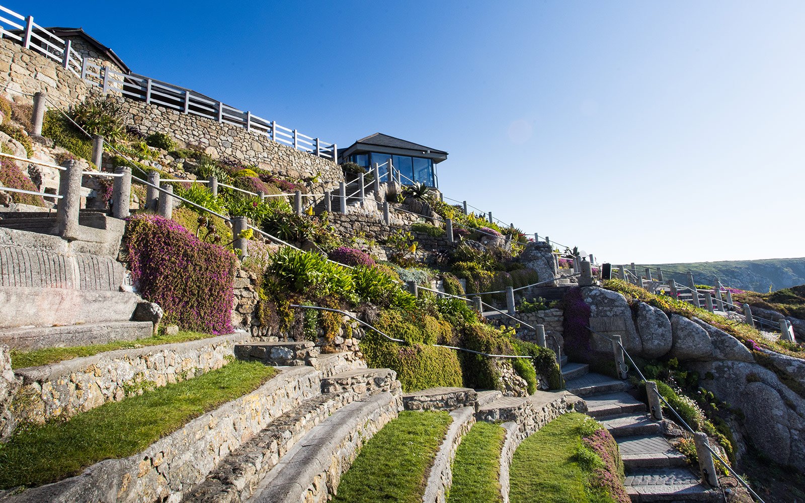 Grass terraces in the Minack with cafe building in distance