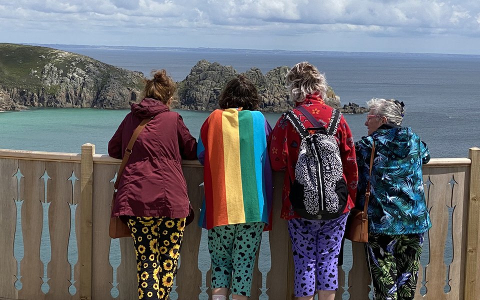 4 tourists enjoying the panorama from the Minack's viewing platform